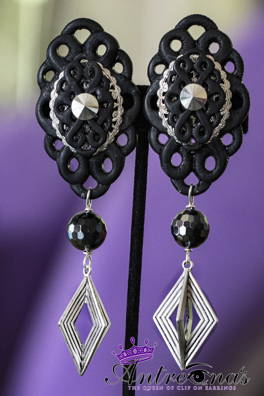 Image black silver clip on earrings